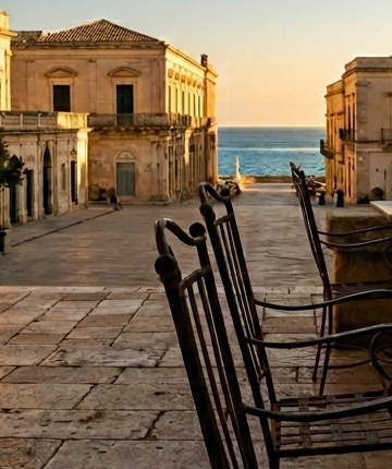 A seaside piazza glowing at golden hour